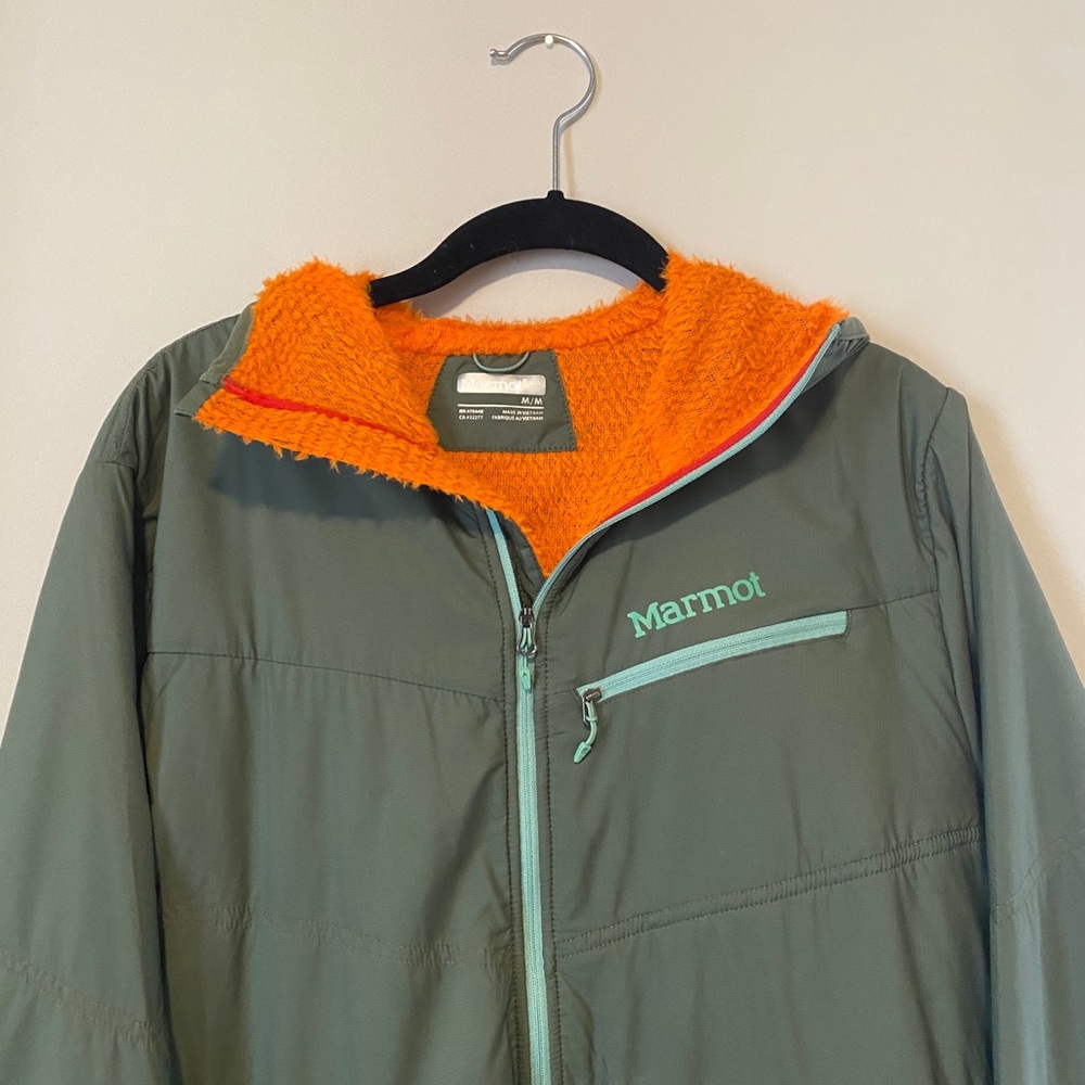 Green and orange marmot zip up